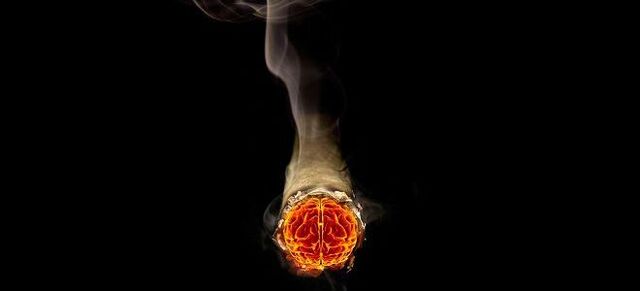 brandende sigaret en de schade van nicotine